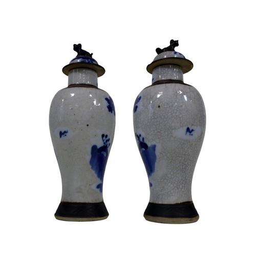 50 - A pair of Chinese crackle glaze inverted baluster shaped vases and covers, character and landscape d... 