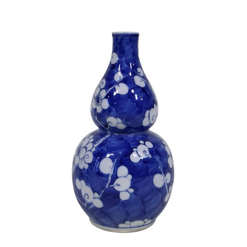 51 - A Chinese blue and white vase with drawn neck, with device panels, further prunus blossom ginger jar... 