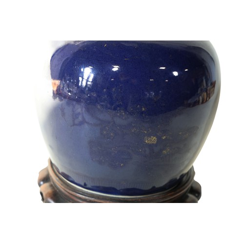 52 - A Chinese blue ground ginger jar, with traces of gilt showing phoenix and floral detail, 20cm