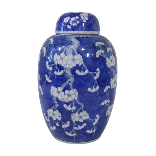 56 - A large late 19th century Chinese blue and white porcelain prunus jar and cover, 35 cm high