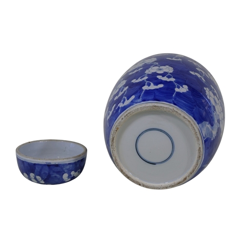56 - A large late 19th century Chinese blue and white porcelain prunus jar and cover, 35 cm high
