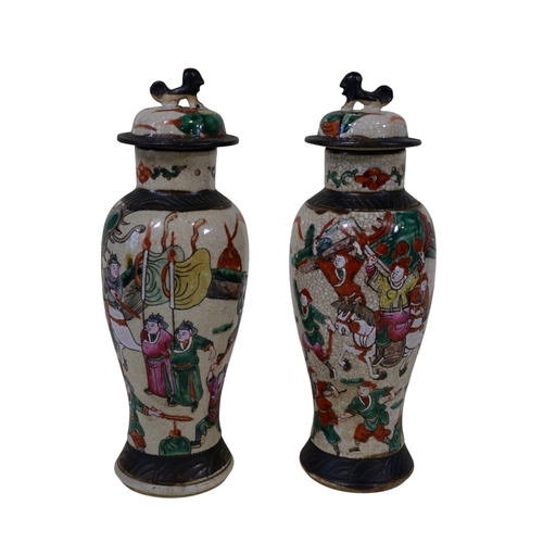 58 - A pair and another 19th century Chinese famille rose crackleware 'warrior' vases, pair with covers a... 