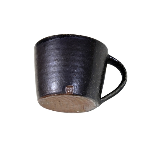 25 - A collection of St Ives Studio pottery, principally in a black colourway, comprising: dish (33cm dia... 
