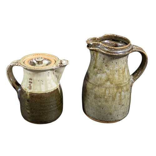 240 - A collection of studio pottery inc jug with loop handle & a further studio jug with handle & lid