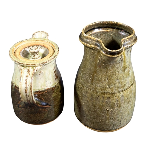 240 - A collection of studio pottery inc jug with loop handle & a further studio jug with handle & lid