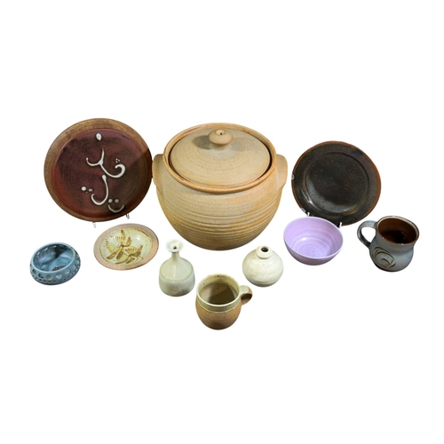 244 - A collection of studio Pottery including Winchcombe pottery, Crock pot, further examples by Anne Jam... 