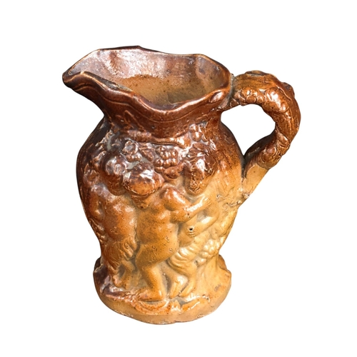 255 - A small 18th C Salt glazed Jug with Bacchanalian figures 8cm High