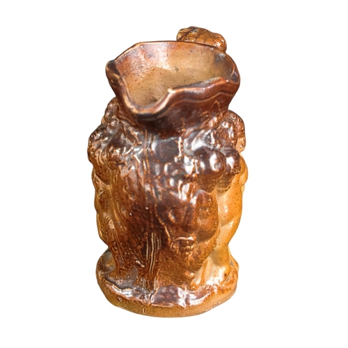 255 - A small 18th C Salt glazed Jug with Bacchanalian figures 8cm High