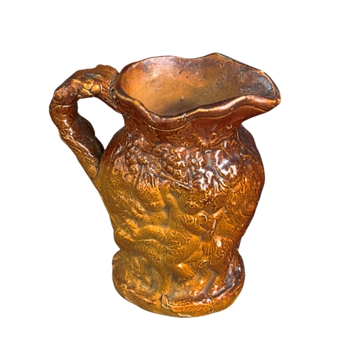 255 - A small 18th C Salt glazed Jug with Bacchanalian figures 8cm High