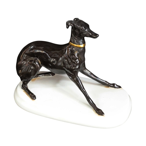 256 - ceramic model of a lively whippet by Michael Sutty 12cm High