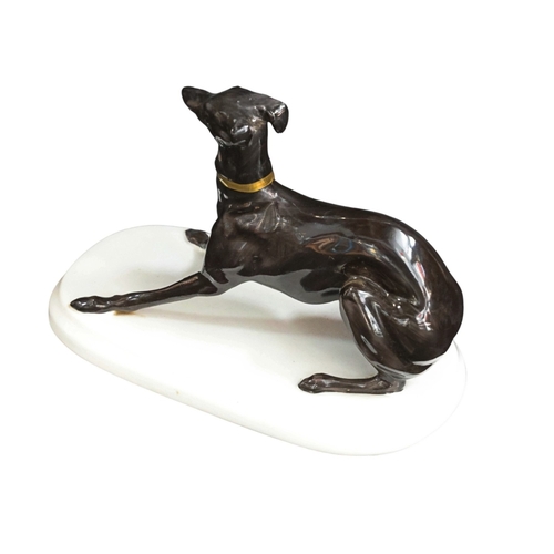 256 - ceramic model of a lively whippet by Michael Sutty 12cm High