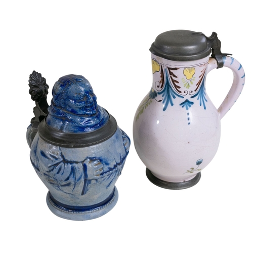 126 - A Berlin stoneware stein in the form of a Monk, further tin glazed jug with pewter cover and 2 x Zso... 