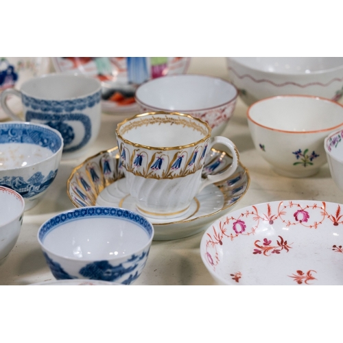127 - A large collection of late 18th c / early 19th C tea bowls & saucers, various designs principally fl... 