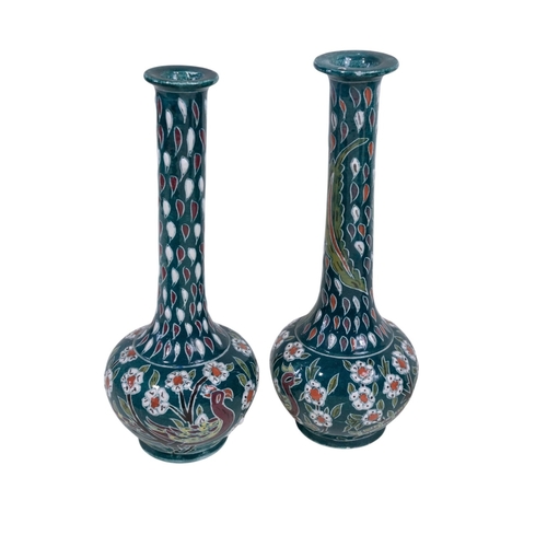 136 - A Austrian wall charger showing Herons, a pair of vases with Drawn necks, bulbous vase with floral d... 
