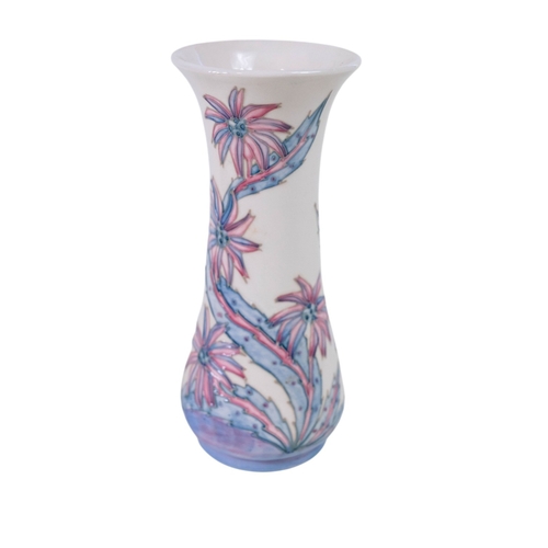 153 - A pair of Moore croft vases - Daisy pattern by Sally Tuffin 21cm High together with a Moore Croft hi... 