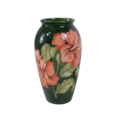 153 - A pair of Moore croft vases - Daisy pattern by Sally Tuffin 21cm High together with a Moore Croft hi... 