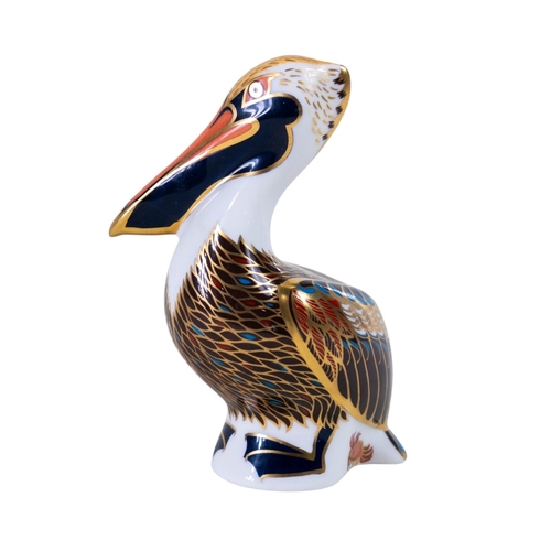 162 - Royal Crown Derby paperweight -the Brown Pelican with silver stopper together with a purple art glas... 