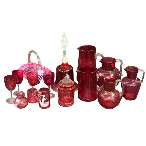 279 - A collection of various Cranberry glassware to include handbell, jugs, glasses, etc.
