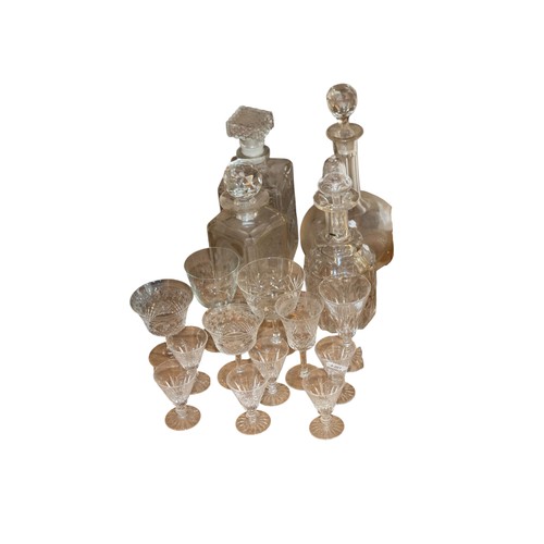 295 - A collection of various clear cut and etched drinking glasses and decanters to include six Waterford... 