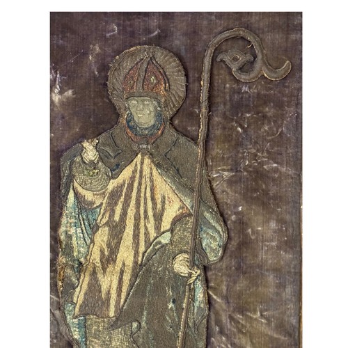 46 - An ecclesiastical Catholic church textile banner, showing a bishop saint holding a crozier, metal th... 