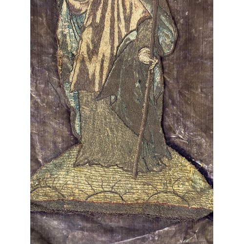 46 - An ecclesiastical Catholic church textile banner, showing a bishop saint holding a crozier, metal th... 