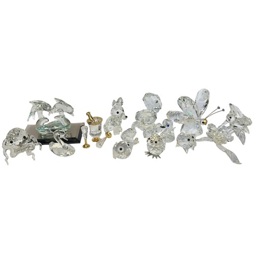 298 - A collection of Swarovski crystal glass figures to include two candlesticks, swan, butterfly, dolphi... 