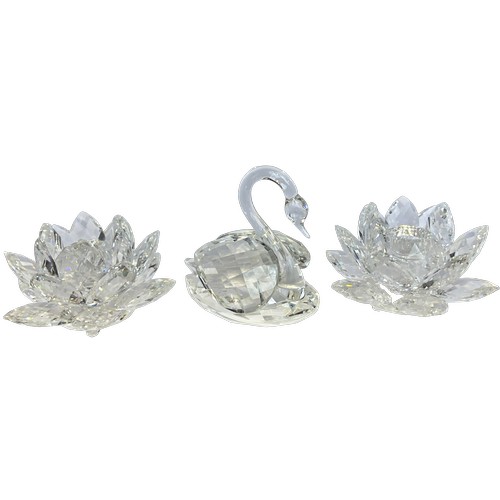 298 - A collection of Swarovski crystal glass figures to include two candlesticks, swan, butterfly, dolphi... 