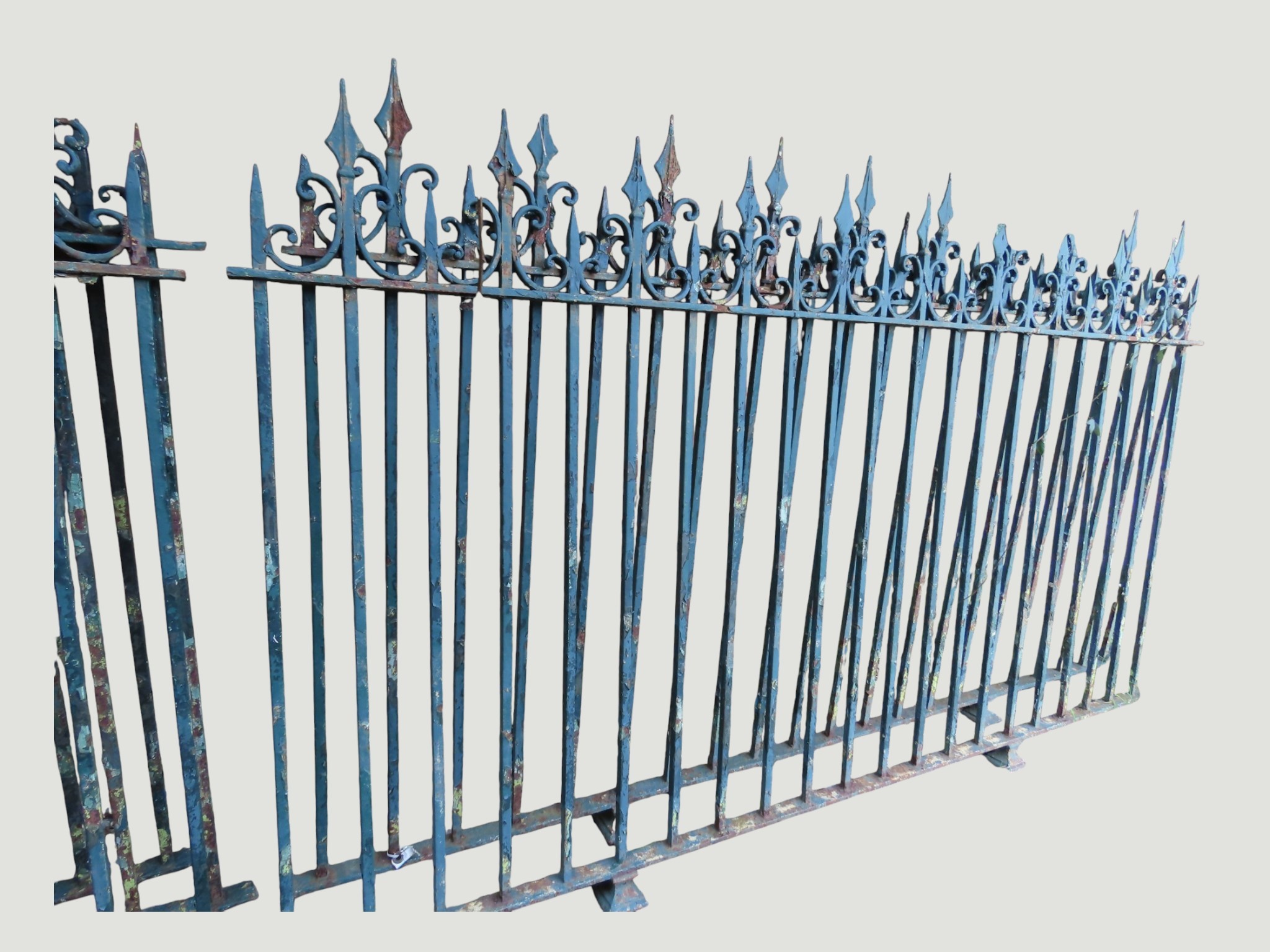 A run of nine sections of heavy gauge green painted and weathered iron ...