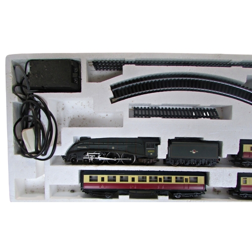 681 - Hornby Railways OO gauge Mighty Mallard with engine, tender, three coaches, mains power controller a... 