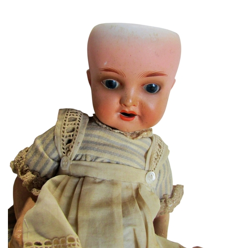 683 - Heubach Koppelsdorf doll 4342-18, another 342-4, Papier mache policeman, toy monkey and other toys