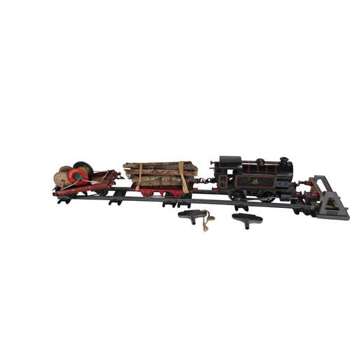 690 - Hornby clockwork O Gauge railway engine, tender and two open waggons with a buffer and tunnel
