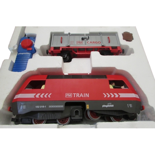 697 - Large quantity of Playmobil including R C Train boxes 4010, 4019, 4385 x 2 and further loose pieces