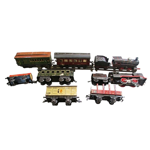 706 - A good collection of pre and post war German toy train effects by Marklin & Bing including two elect... 