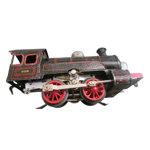 706 - A good collection of pre and post war German toy train effects by Marklin & Bing including two elect... 