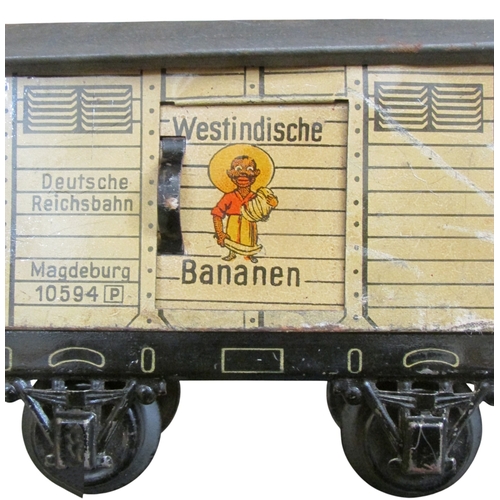 706 - A good collection of pre and post war German toy train effects by Marklin & Bing including two elect... 