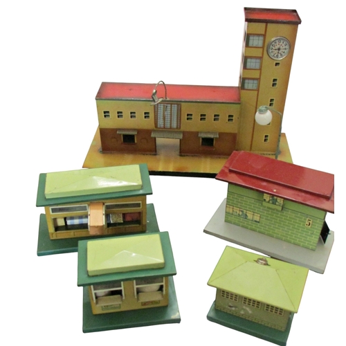 706 - A good collection of pre and post war German toy train effects by Marklin & Bing including two elect... 
