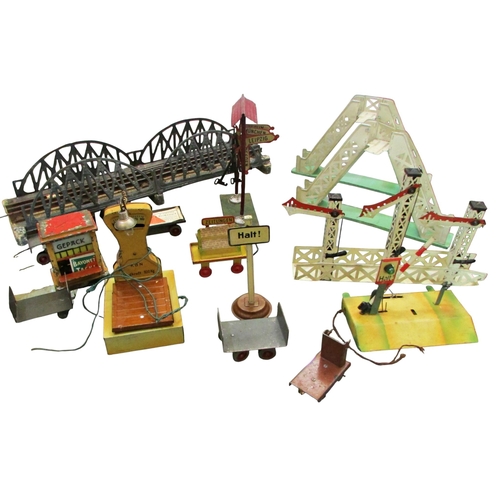 706 - A good collection of pre and post war German toy train effects by Marklin & Bing including two elect... 