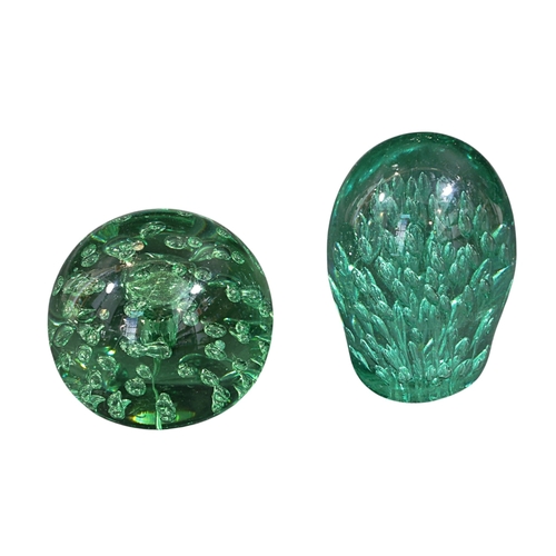 262 - Two Victorian green glass dump paperweights, largest 14cm