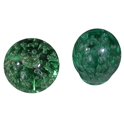 262 - Two Victorian green glass dump paperweights, largest 14cm