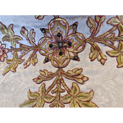 710A - Religious interest; an early 20th century needlework and gold brocade embroidered alter panel with f... 