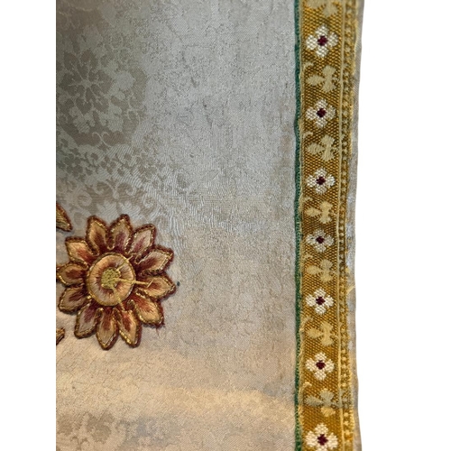 710A - Religious interest; an early 20th century needlework and gold brocade embroidered alter panel with f... 