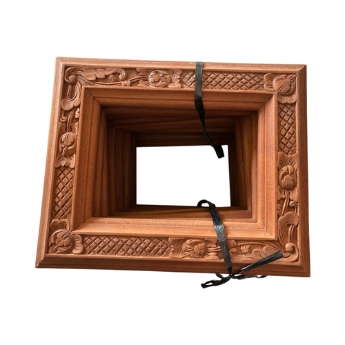 Twenty floral carved mahogany picture frames, rabbet size: 18 x 13 cm (20)