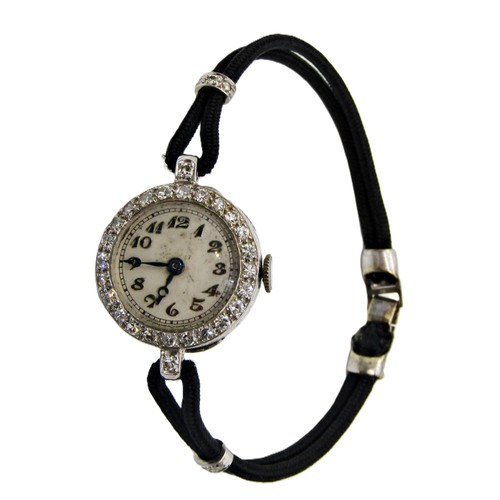418 - An Art Deco period diamond set platinum cased cocktail wristwatch, the circular dial populated with ... 