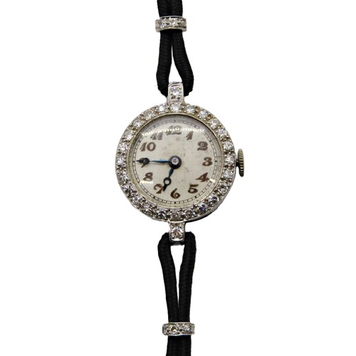 418 - An Art Deco period diamond set platinum cased cocktail wristwatch, the circular dial populated with ... 