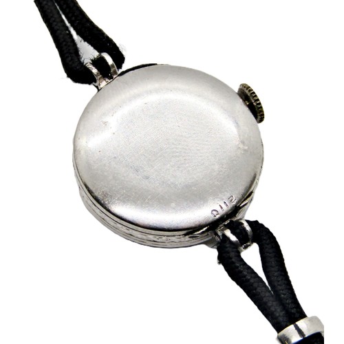 418 - An Art Deco period diamond set platinum cased cocktail wristwatch, the circular dial populated with ... 
