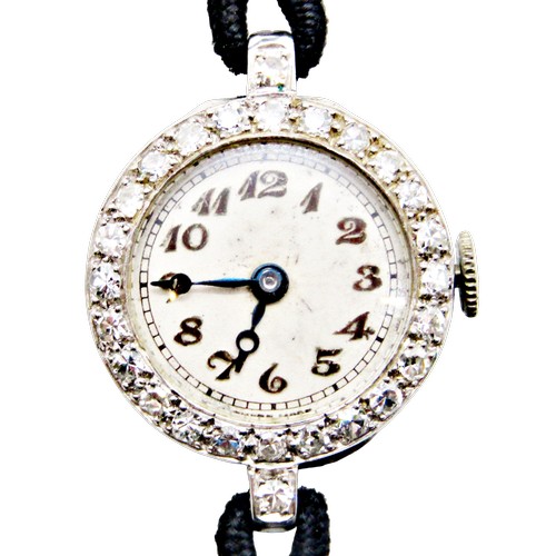 418 - An Art Deco period diamond set platinum cased cocktail wristwatch, the circular dial populated with ... 