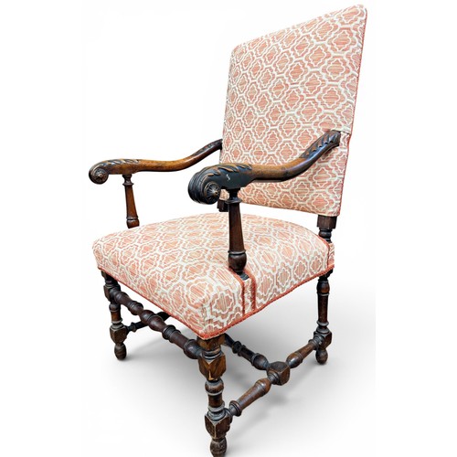 573 - A late 17th century walnut armchair, with acanthus carved arms and handrests, raised on turned legs ... 
