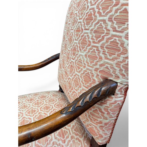 573 - A late 17th century walnut armchair, with acanthus carved arms and handrests, raised on turned legs ... 