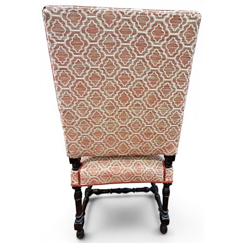 573 - A late 17th century walnut armchair, with acanthus carved arms and handrests, raised on turned legs ... 