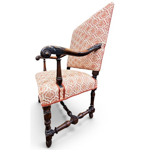 573 - A late 17th century walnut armchair, with acanthus carved arms and handrests, raised on turned legs ... 
